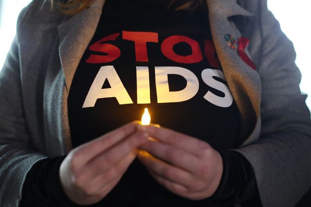 People attending a candlelit vigil for World Aids Day, in Spring Gardens, London. PRESS ASSOCIATION Photo. Picture date: Saturday December 1, 2018. Photo credit should read: Yui Mok/PA Wire