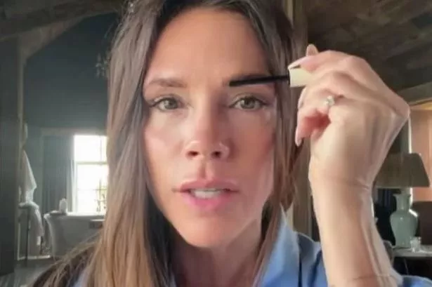 Victoria Beckham using the FeatherFix Brow Gel from her beauty brand