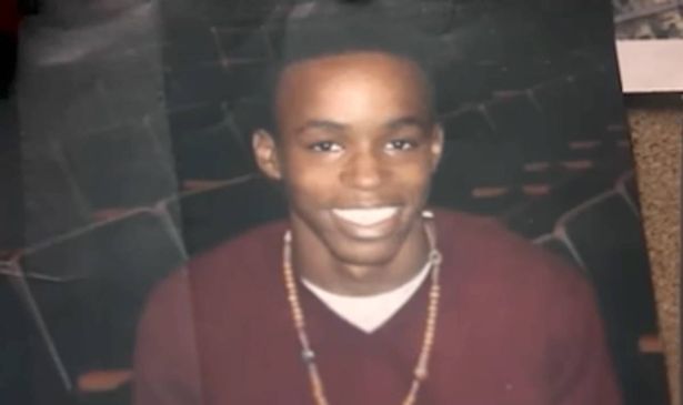 A photograph of a man smiling