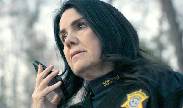 A police officer talks on the phone