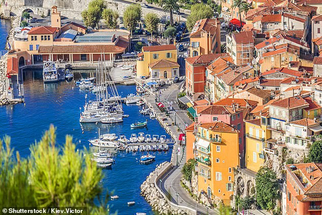 Pictured: A view of luxury resort Villefranche-sur-Mer and bay on French Riviera at Mediterranean Sea