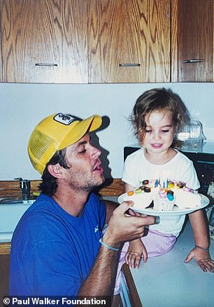 The trio of snaps featured Meadow sitting on a kitchen counter, dressed in a white T-shirt and pink pants as Paul joined her in a yellow trucker hat and blue T-shirt