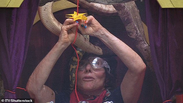 A snake is shown coming very close to Ruby's face - as she tries to complete the trial and not panic