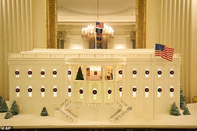 The annual White House Gingerbread House this year included a rare glimpse inside the Yellow Oval Room of the president's residence. The concoction is mroe than 200 pounds