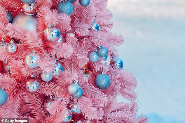 Lean in to the fact your tree is artificial and try going for a bold colour (stock image)
