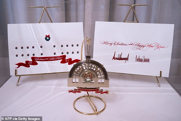 A Christmas card from US President Donald Trump and First Lady Melania Trump are displayed at the White House