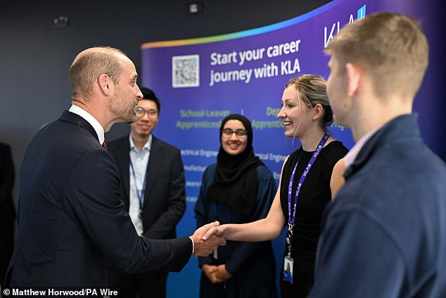 Prince William is pictured meeting employees during his visit to the newly opened facility of international semiconductor company KLA in Newport on Monday