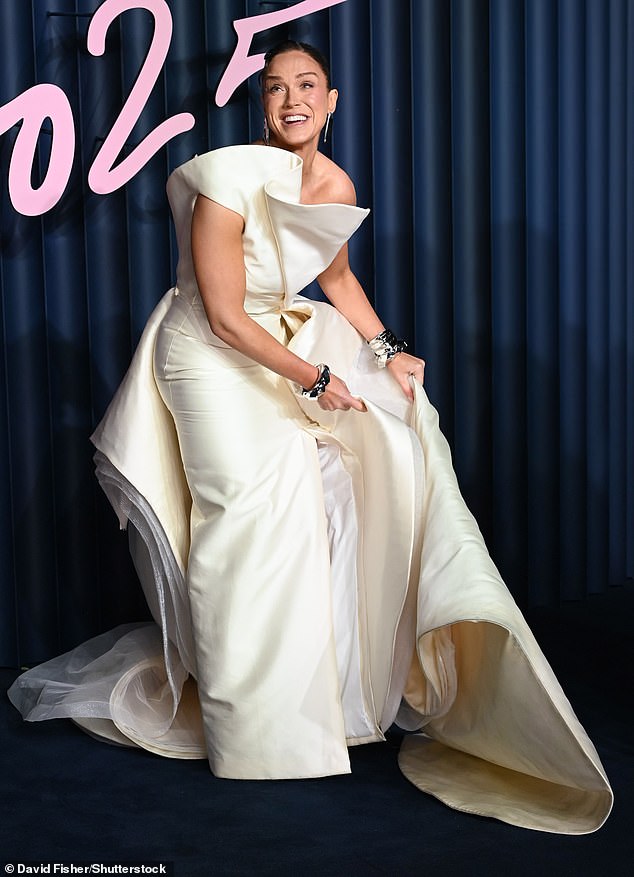 At one point, the star came dangerously close to suffering a wardrobe malfunction as she adjusted her dress on the blue carpet