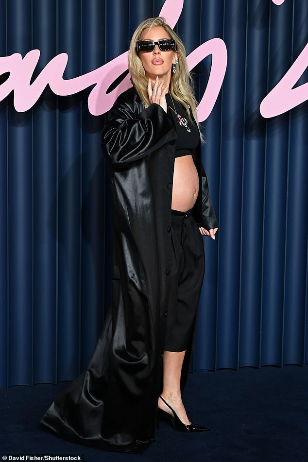 The singer showed off her bare bump in a revealing black crop top and culottes as she arrived for the ceremony in London's Royal Albert Hall