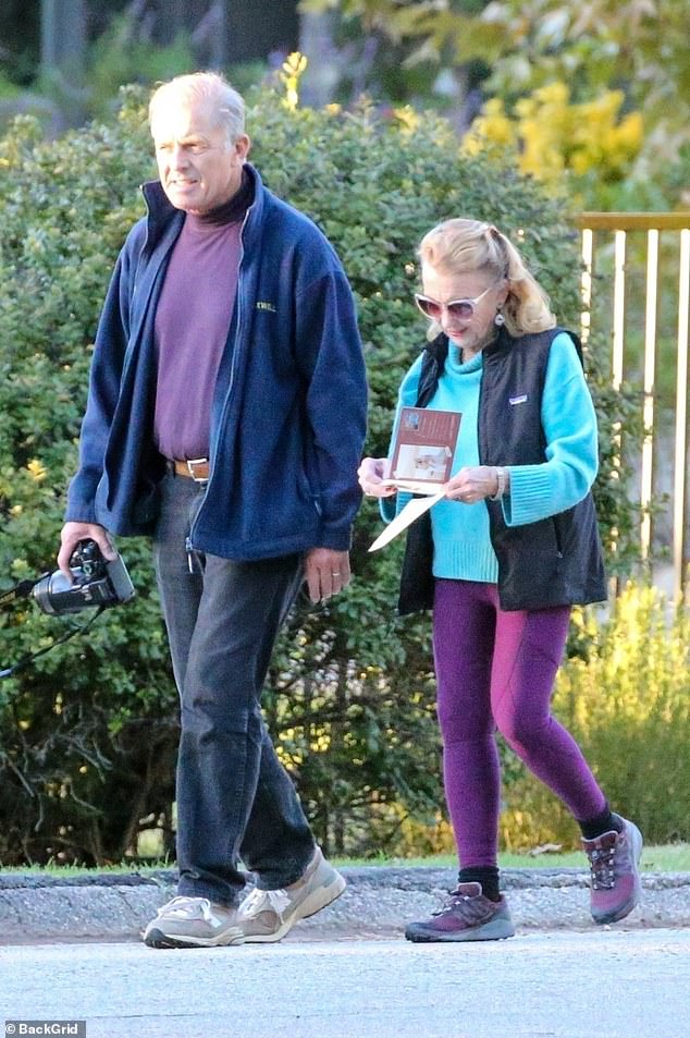 Juliet appeared to be examining a card during their trek