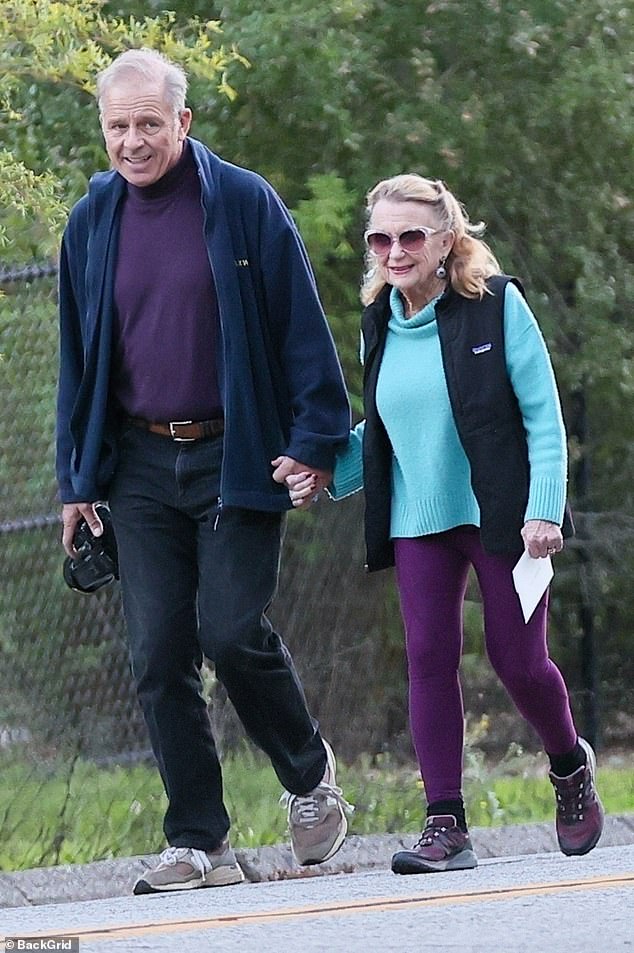 A Hollywood golden couple with an 18 year age-gap looked as smitten as can be during a leisurely stroll