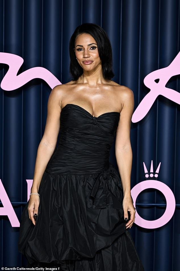 The BBC Radio 1 opted for the elegant black satin look as she made a solo appearance at the ceremony