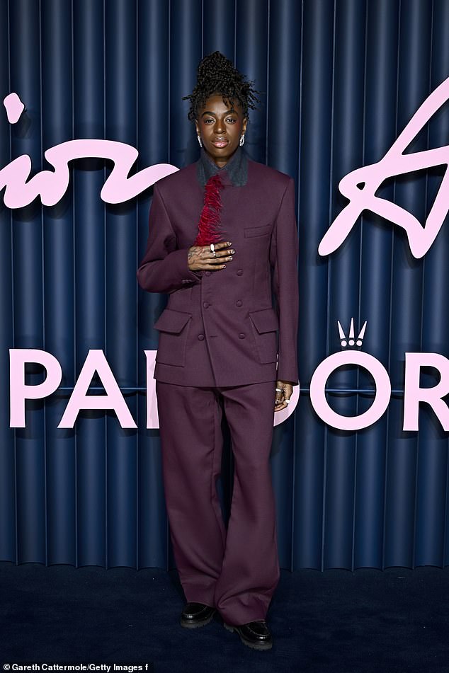 Fellow Traitors star Cat Burns showed off her individual sense of style in a purple double breasted suit