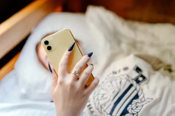 Portrait of a teenage girl with mobile phone.