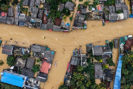 An aerial view shows houses partially submerged in floodwaters after heavy rainfall in Kaduwela on the outskirts of Colombo on 29 November.