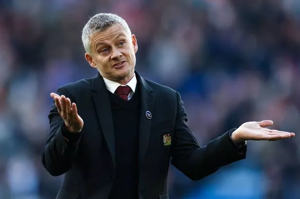 Ole Gunnar Solskjaer puts both his hands up