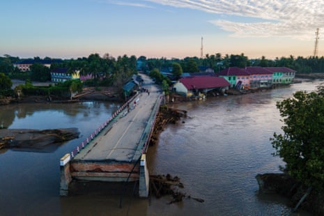 The floods in Indonesia’s Aceh province washed away part of a bridge in Pidie Jaya district on Sunday.