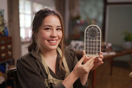 Hannah Lemon with the miniature stained glass window she made for Crumpsall library.