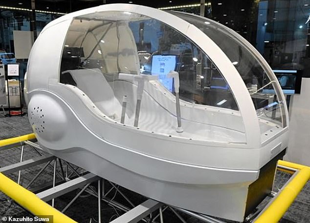 The fighter jet cockpit-shaped pod is big enough for someone to lie down inside. The pod then fills with water, and the bather is blasted with high-speed jets of bubbles